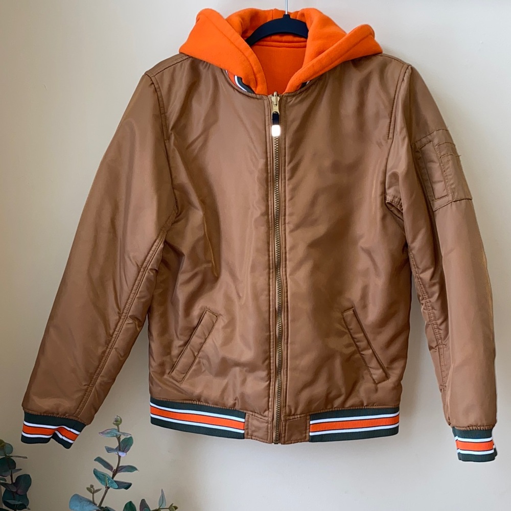Kids Tan/Brown Reversible Bomber Jacket with Hood and Orange/Green Accents.